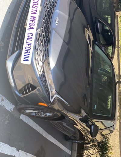A shiny, well-maintained vehicle captured from a side angle.